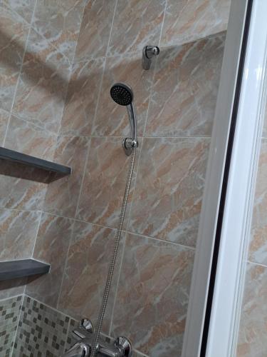 a shower with a shower head in a bathroom at Casa Tía Daniela AT CC- 00937 in Casas de Millán
