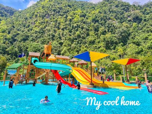a water park with a slide in the water at Sunway Onsen Suite Theme Park View Top Floor at Lost World in Tambun