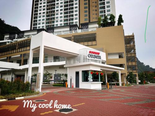 a building with a sign that reads my good home at Sunway Onsen Suite Theme Park View Top Floor at Lost World in Tambun