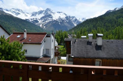 a view of snowy mountains from a house at Haus Lena in Solda
