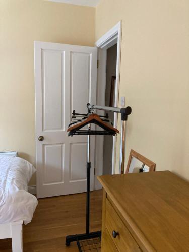 a room with a tripod in front of a bed at Woodside in Nenagh