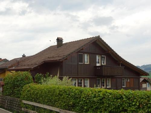 a brown house with a brown roof at Ferienwohnung Inauen in Appenzell