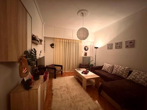a living room with a couch and a table at MaFi Apartment in Ioannina