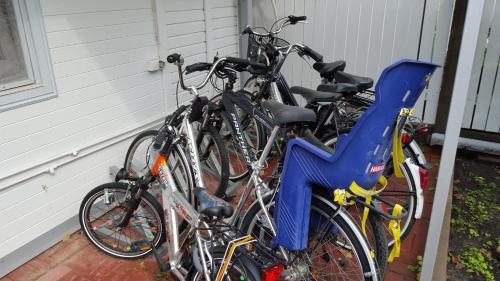 a group of bikes parked next to a house at Naiza Guesthouse and Apartments in Jūrmala