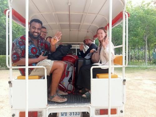 a group of people sitting in the back of a bus at Baan Kebsap บ้านเก็บทรัพย์ in Ko Yao Noi