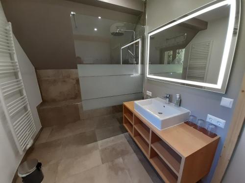 a bathroom with a sink and a mirror at Romantik Chalet Pretalhof in Turnau