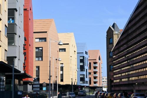 a city street with tall buildings in a city at All Suites Appart Hôtel - Dunkerque Centre in Dunkerque