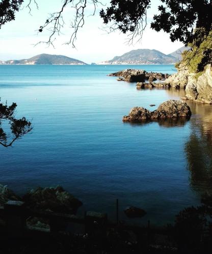a large body of water with rocks in it at IL PEPE ROSA di Anna e Silvano in Sarzana