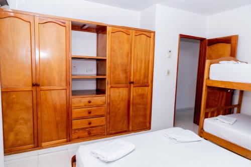 Ένα ή περισσότερα κρεβάτια σε δωμάτιο στο Edificio Sandra