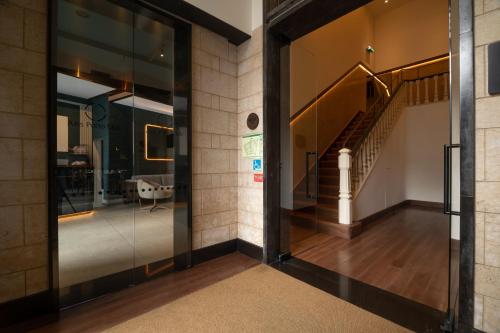 an entrance to a building with glass doors and a staircase at Axis Porto Club Aliados in Porto