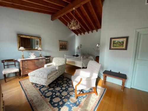 a living room with a couch and chairs and a table at The Salvia - Adults Only in Sóller