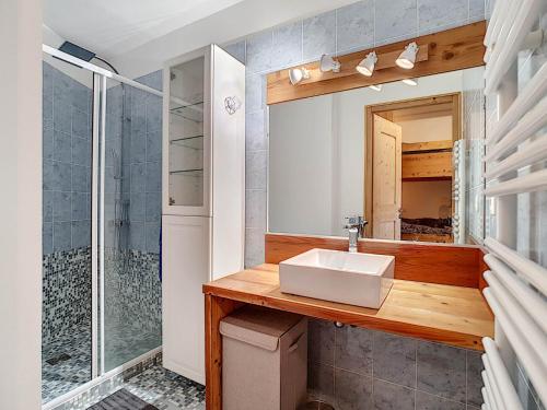 a bathroom with a sink and a shower at Chalet des pistes CP0458 in La Clusaz