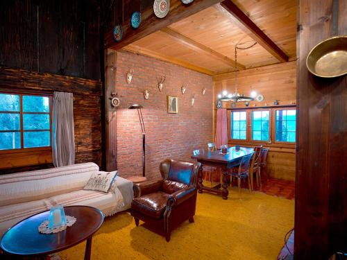 a living room with a couch and a table at Chuderhuette in Wyssachen