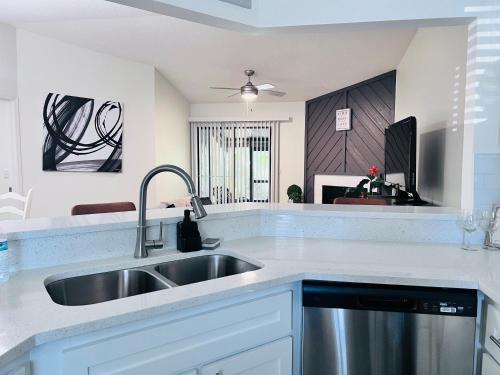 a kitchen with a sink and a counter top at Urban Oasis Getaway in Jacksonville