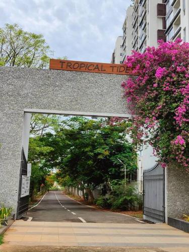 an entrance to a road with a sign over it at Happy Home 3BHK Condo - Muttukadu ECR in Chennai