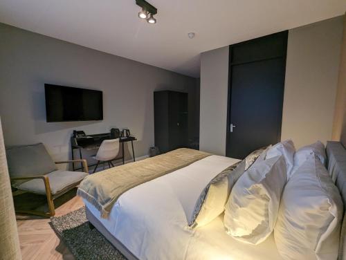 Veluwe Hotel De Beyaerdにあるベッド