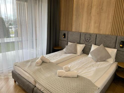 Postel nebo postele na pokoji v ubytování Apartament K Laguna Beskidów