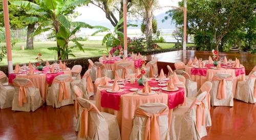 a group of tables with pink and white tablecloths at El Chante Spa Hotel in Jocotepec