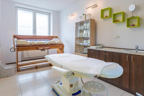 a hospital room with a bed and a table at Ryterski in Rytro