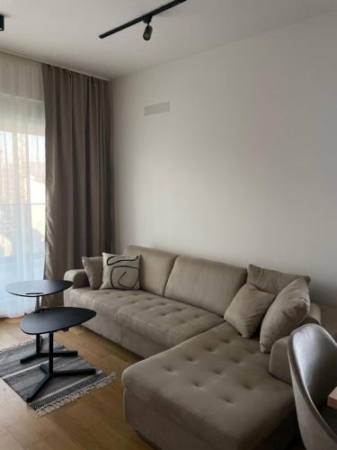 a living room with a couch and a table at Apartment ALPHA in Banja Luka