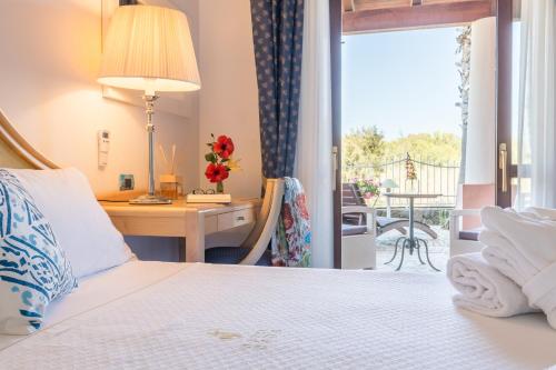 Ένα ή περισσότερα κρεβάτια σε δωμάτιο στο Hotel Eros
