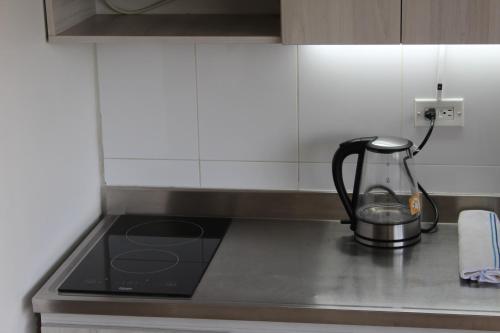 Una cocina o cocineta en LLanogrande Apartamento Estudio Puerto Bulevar