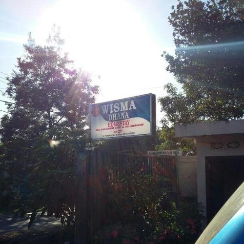 a sign for a usna drink in front of a building at Wisma Dhana Syariah in Praya