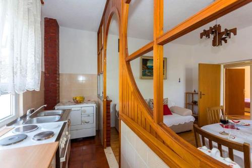 a kitchen with a sink and a counter top at Peaceful Oasis in Banići