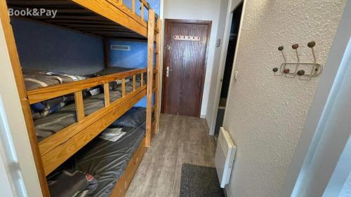 a hallway with bunk beds in a dorm room at La Piste in Saint-Lary-Soulan