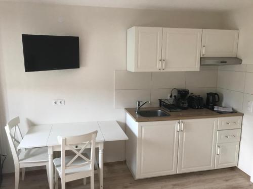 Una cocina o zona de cocina en Fiore Gästezimmer