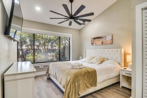 a bedroom with a bed and a window at Serene St Petersburg Home with Private Hot Tub in St Petersburg