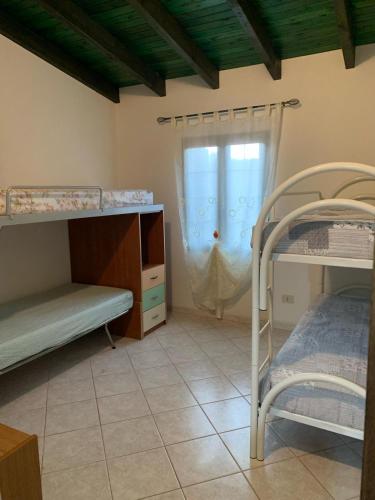 Двухъярусная кровать или двухъярусные кровати в номере Sa cruxi