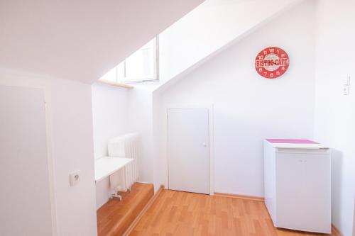 a white room with a door and a window at Podwale str Large flat in the heart of Old Town in Warsaw
