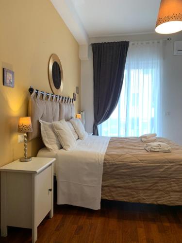 a bedroom with a large bed and a window at Beside the Vatican in Rome