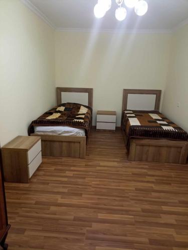 Giường trong phòng chung tại Mini Apartment In Kutaisi