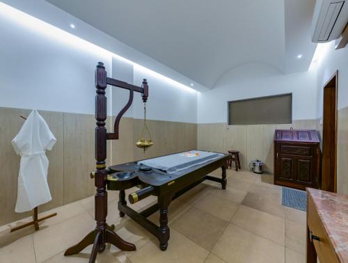 a room with a pool table in a room at Highland Club with Swimming Pool-GYM in Kolhapur