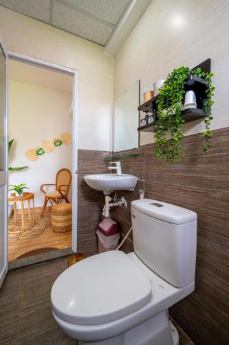 a bathroom with a toilet and a sink at Alana Homestay Hoi An in Hoi An