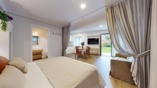 a bedroom with a bed and a desk and a table at Le Petit Apartamentos in Santander