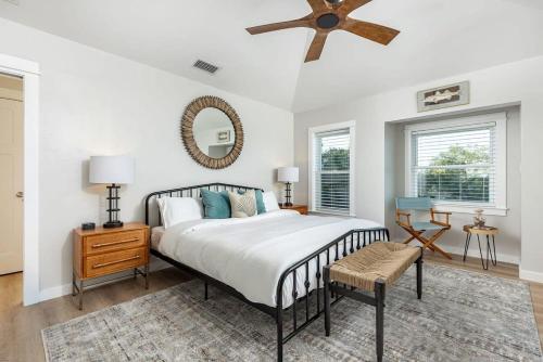 a bedroom with a bed and a ceiling fan at 3 Story Haven Fire Pit kayaks updated 360 Views in Cedar Key
