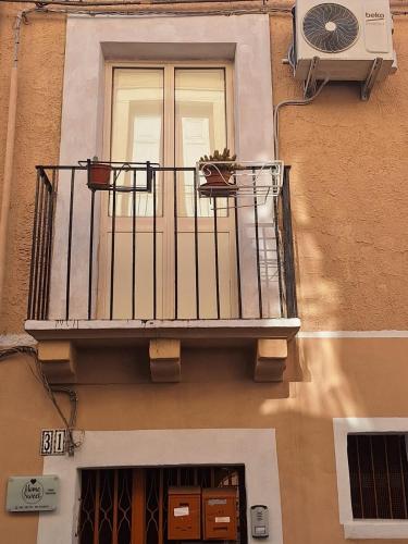 a balcony on the side of a building with a window at Homesweet in Catania