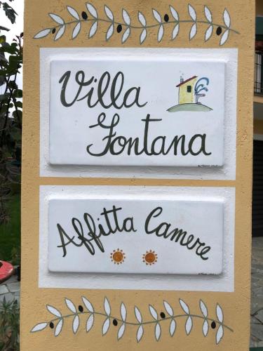 three signs with the names of three different countries at Villa Fontana in Celle Ligure