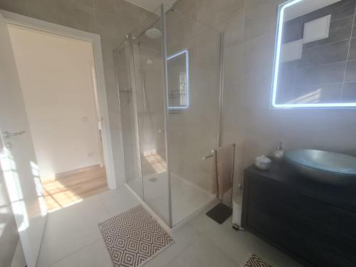 a bathroom with a glass shower and a sink at Exclusive Villa Toulouse with pool in Falesia Algarve in Albufeira