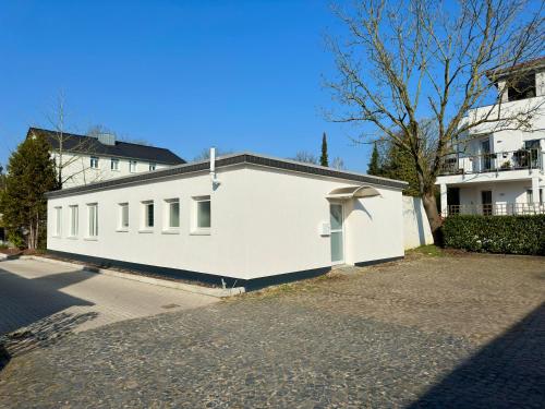 a white building on the side of a street at renovierte & voll möblierte Wohnung für 7 Personen in Minden