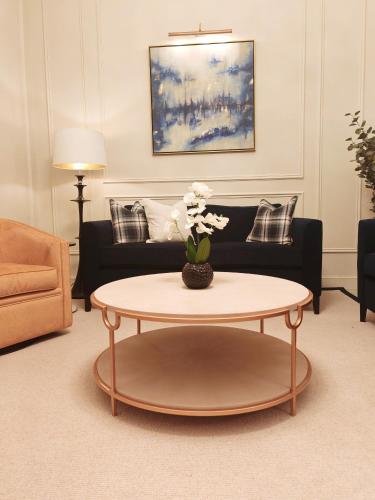 a living room with a coffee table and a couch at Frederick House Hotel in Edinburgh