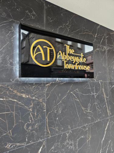 a sign on the wall of a luxury house at The Abbeygate Townhouse in Galway