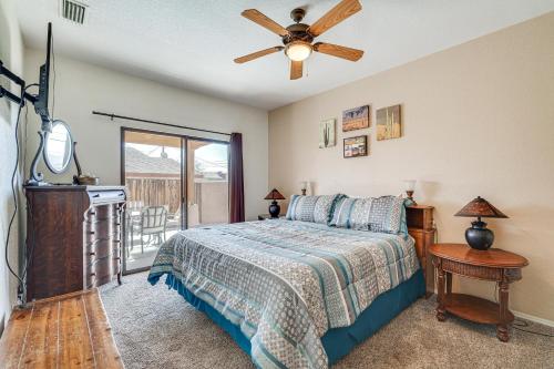 a bedroom with a bed and a ceiling fan at Lake Havasu City Duplex about 1 Mi to London Bridge! in Lake Havasu City