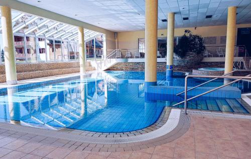 a large swimming pool in a large building at Awesome Apartment In Pohorje With Wifi in Pohorje