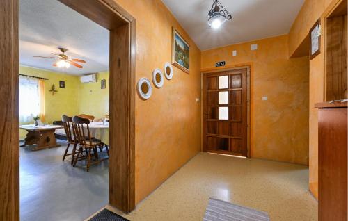 a living room with a table and a dining room at Lovely Home In Vinogradi Ludbreski in Ludbreg