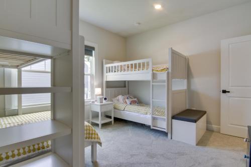 a room with two bunk beds and a desk at Beach House with Deck and Pool Access in Rehoboth in Rehoboth Beach