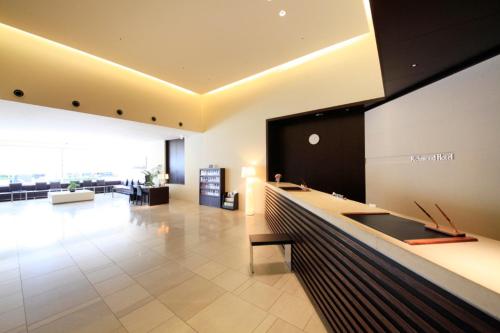 a lobby with a reception desk in a building at Richmond Hotel Fukushima Ekimae in Fukushima